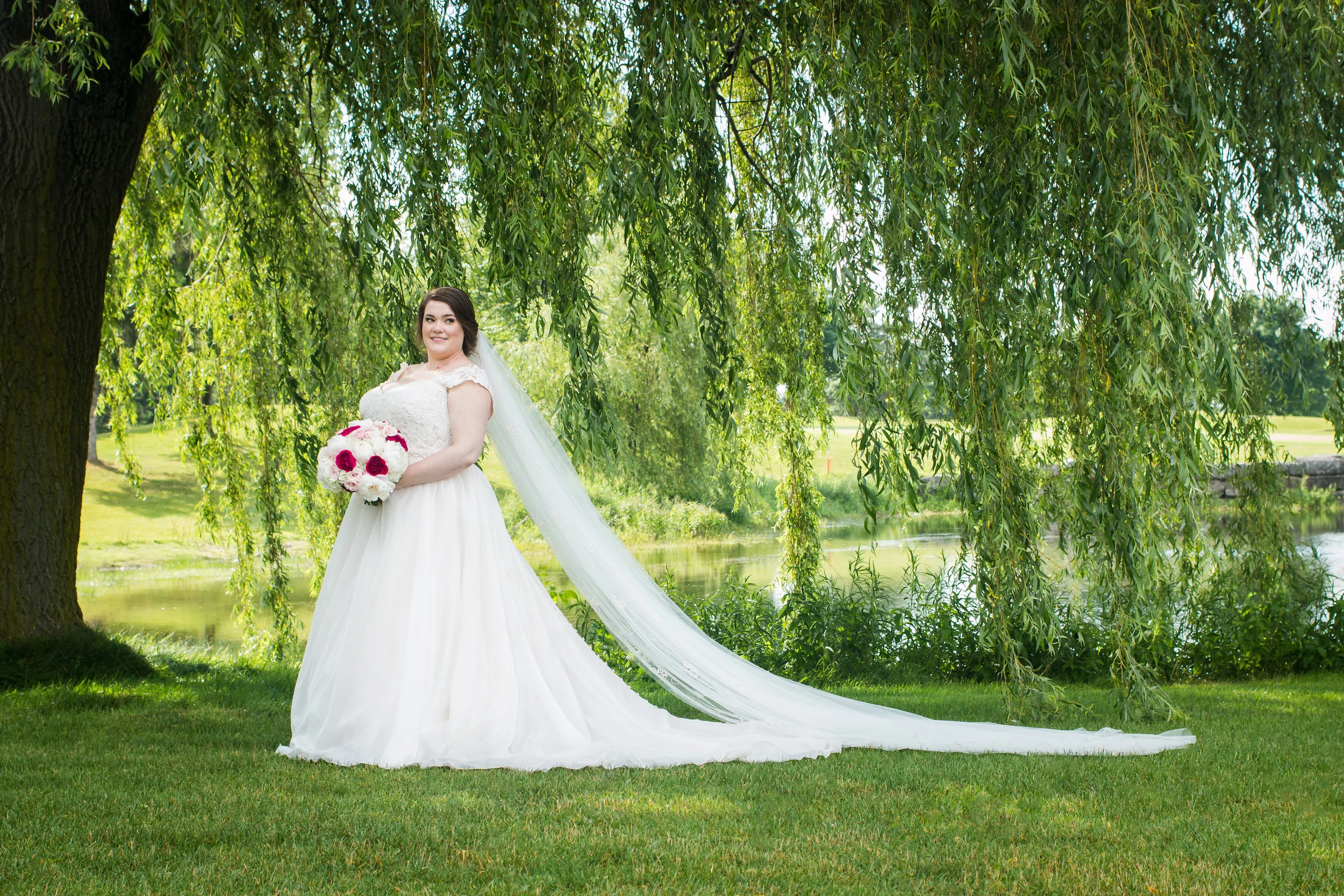 emilysotiphotography-LIB-amber+tyler-bridetrainveil.jpg