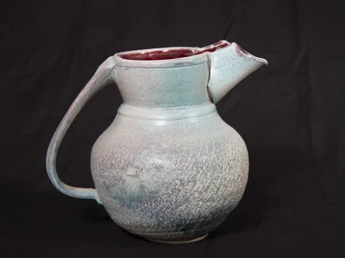 Blue-green textured pitcher.