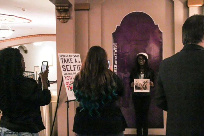 A photo of our #ARTwithaTWIST winner, Aaliyah Pitts, holding her winning piece! (Photo credit: Euniece Harris)
