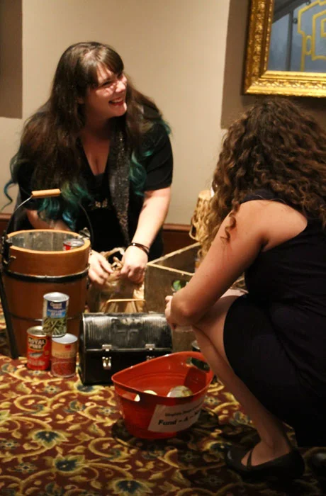 A couple of our staff members unloading donated cans in the collection area. (Photo credit: Euniece Harris)