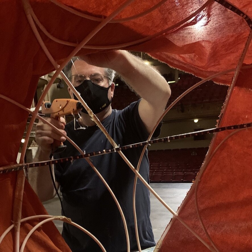 Volunteer Matthew Bernier Covers Saturn with Fabric.jpeg