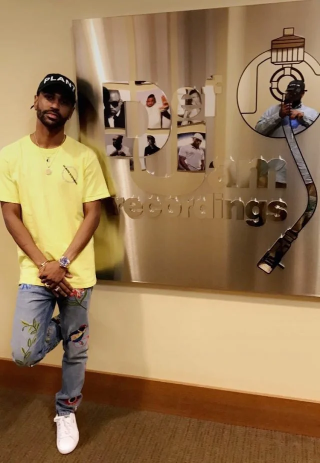 Big Sean in a CPFM hat C/O Notey