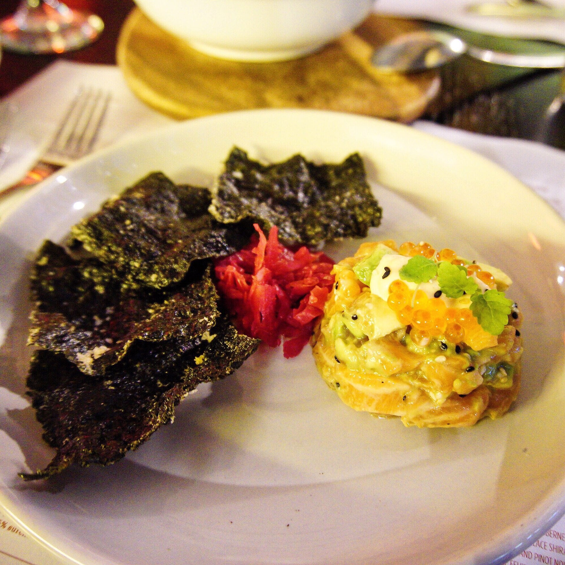 The Heirloom's salmon tartare with crispy nori, avocado, salmon roe and kimchi (GF)
