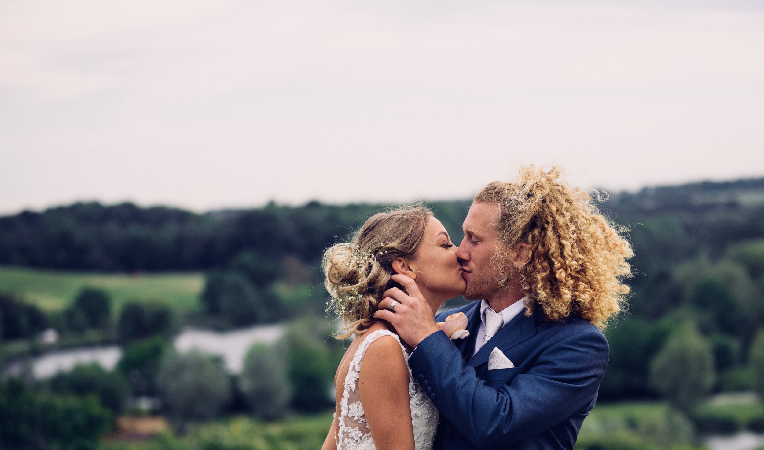 Bride and Groom kissing with a fabulous background