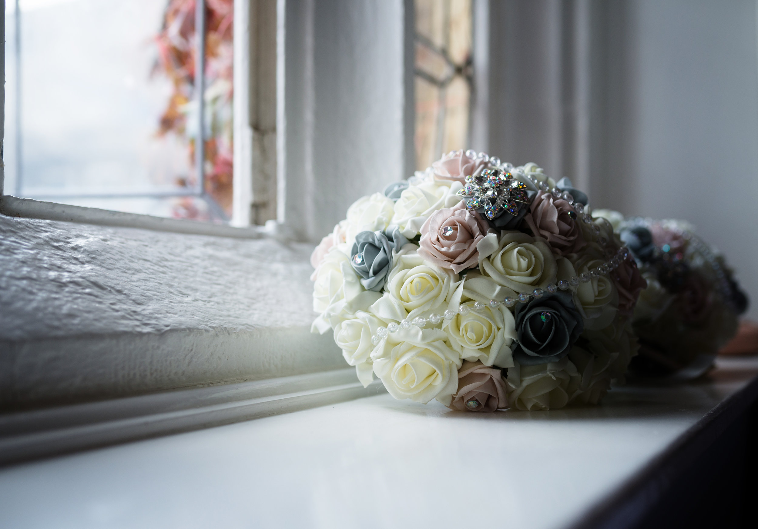 Bridal bouquet on a window ledge