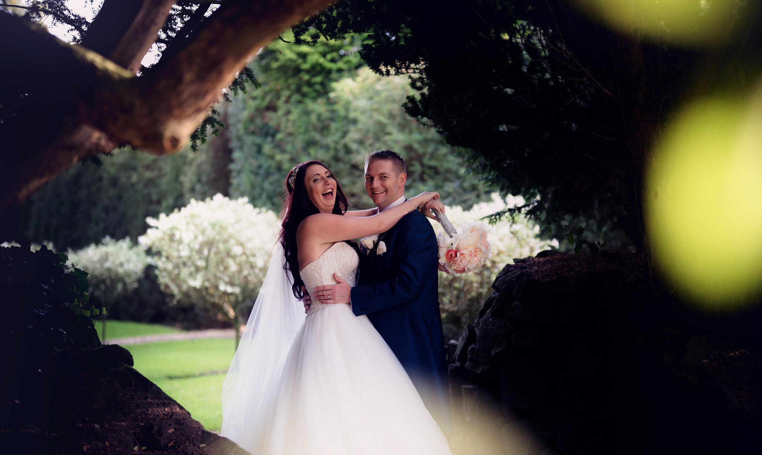 The bride and groom out in the gardens for some fun photos and a chance to escape the madness for a few minutes