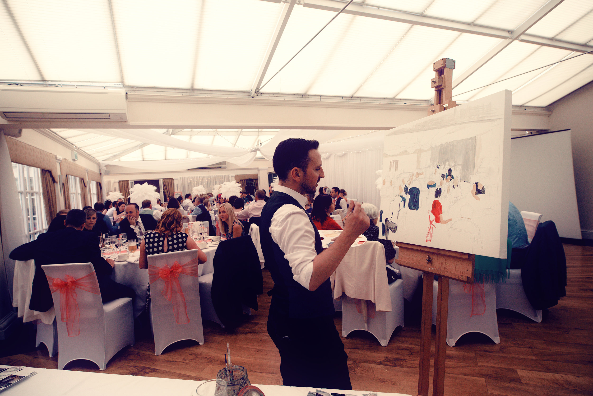 Mr Stuart Barkley Live wedding painter capturing the wedding breakfast