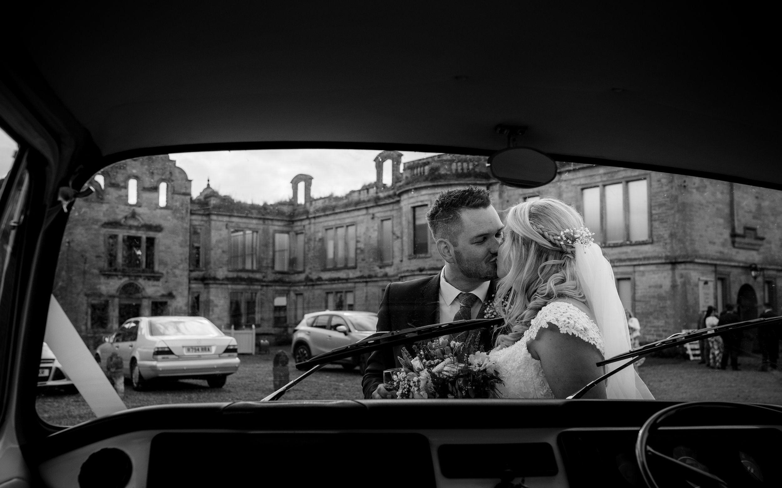 The bride and groom from inside the vw camper van