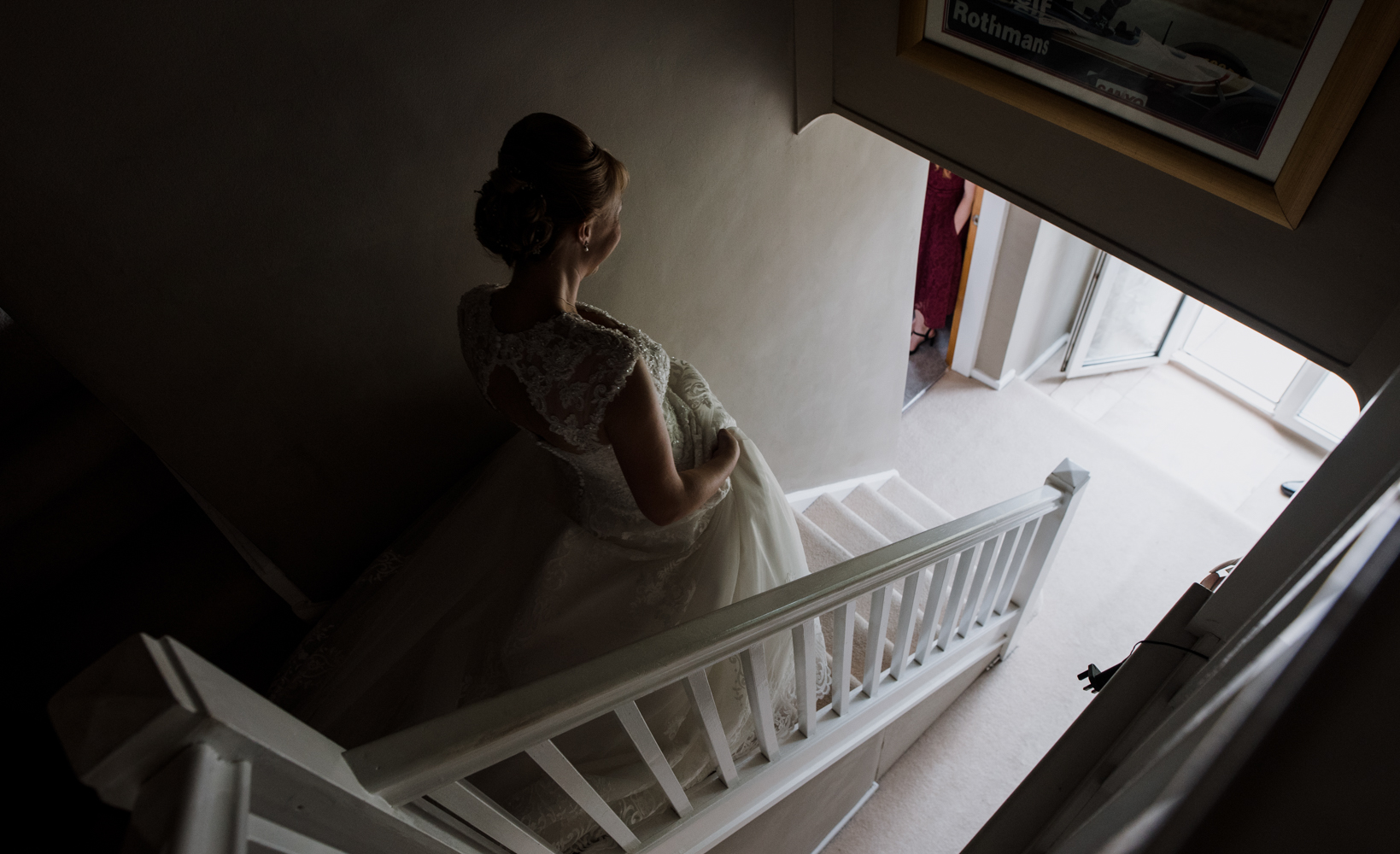 The bride walking down the stairs towards her waiting father