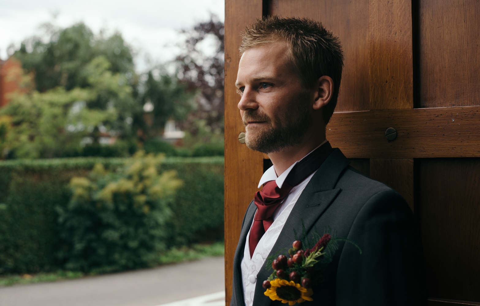 A rather nervous looking groom awaiting the arrival of the bride