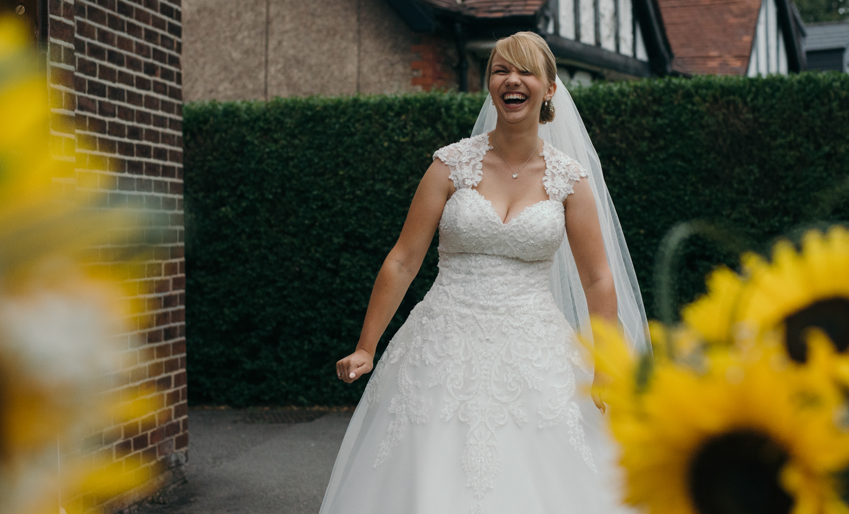 The bride acting silly before going in to church for her wedding ceremony