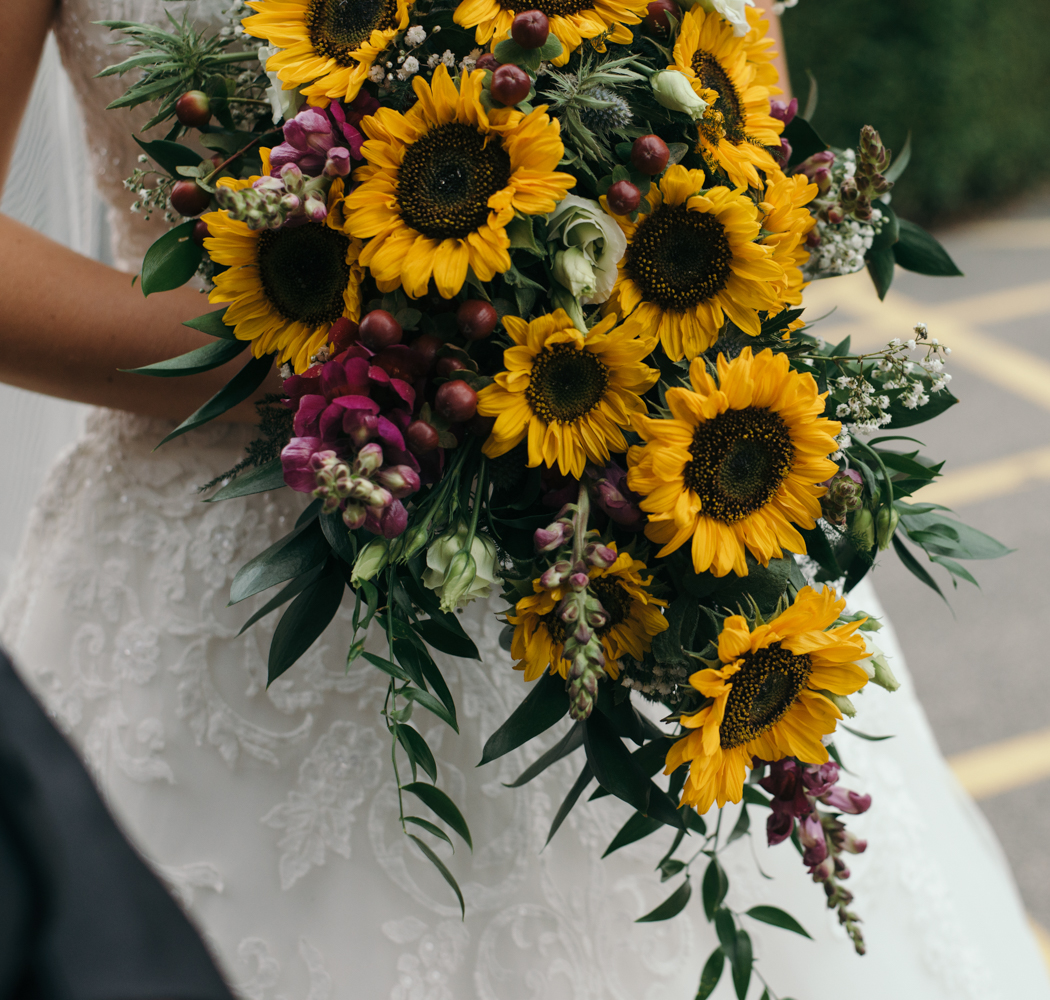 It's those sunflowers again this time the brides wonderful bouquet