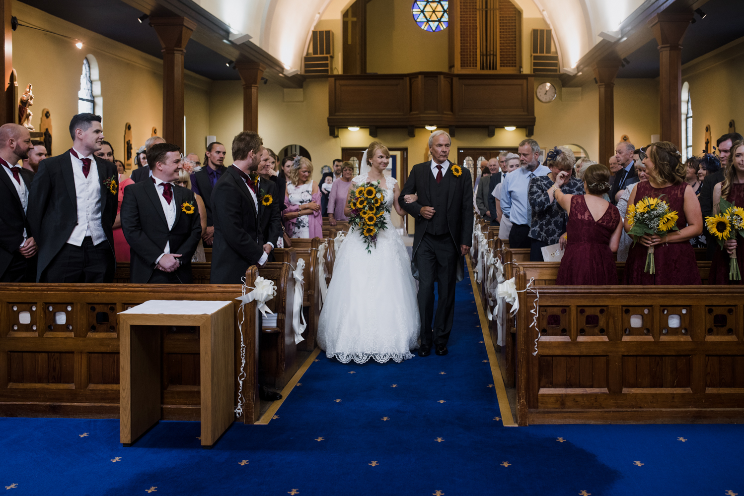 The bride and her father walking down the aisle