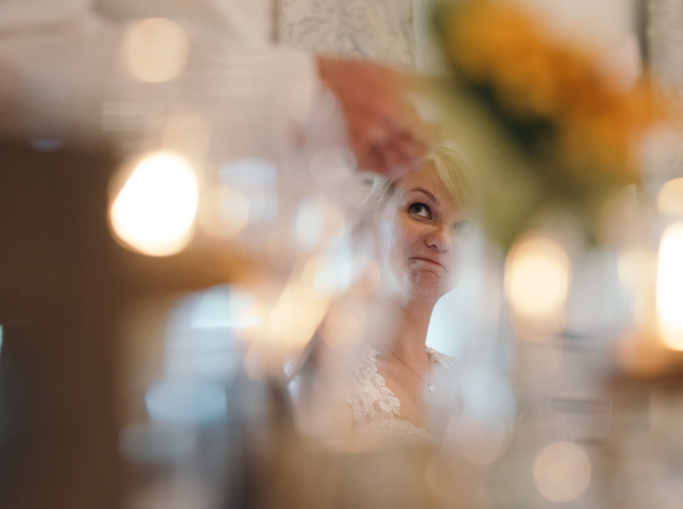 The bride during the speeches looking at her new husband