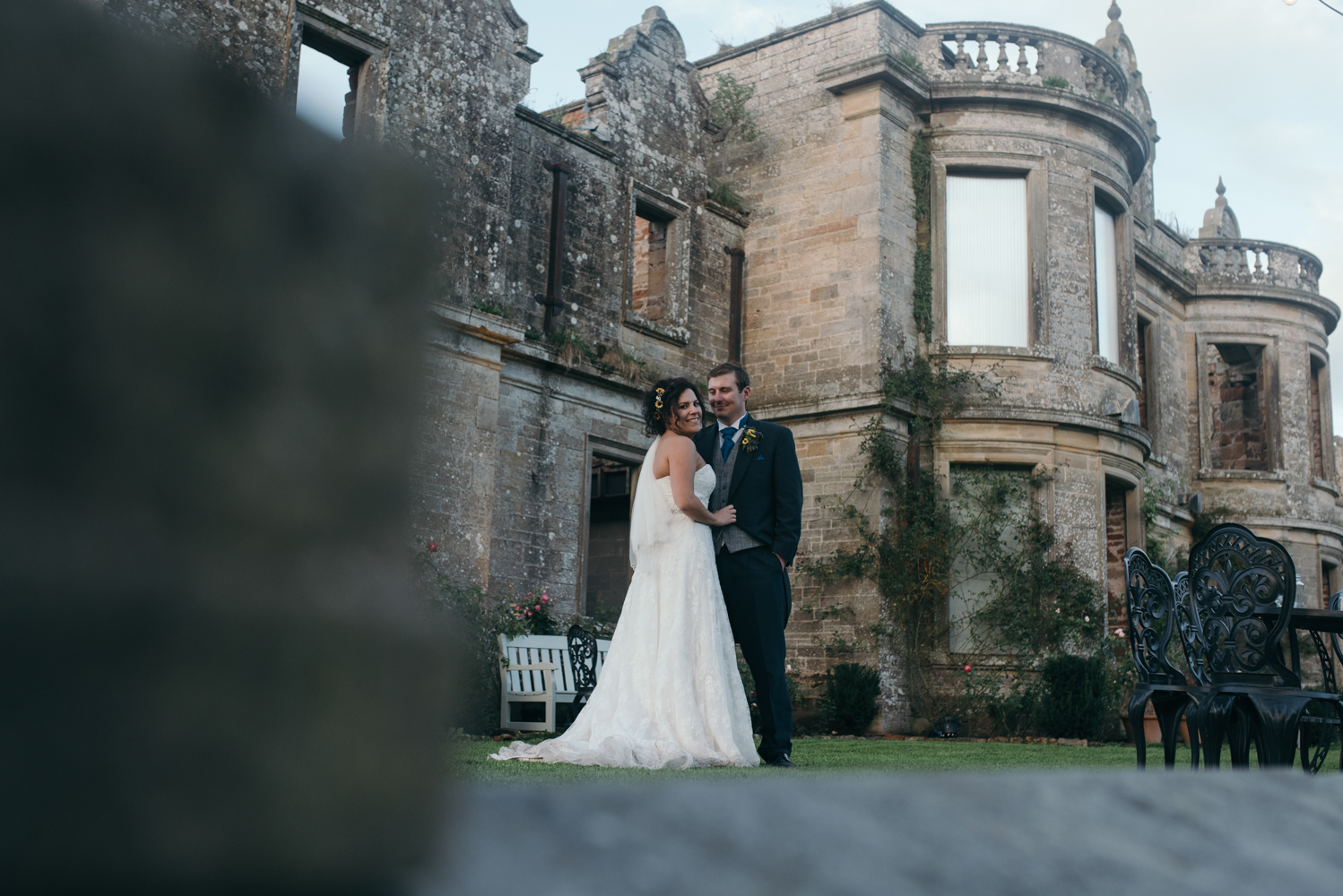 Bride and groom portrait with Kirklinton Hall in the background