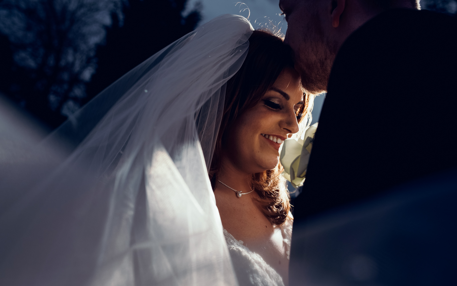 A photo from the bride and grooms formal portrait session this time in the dark