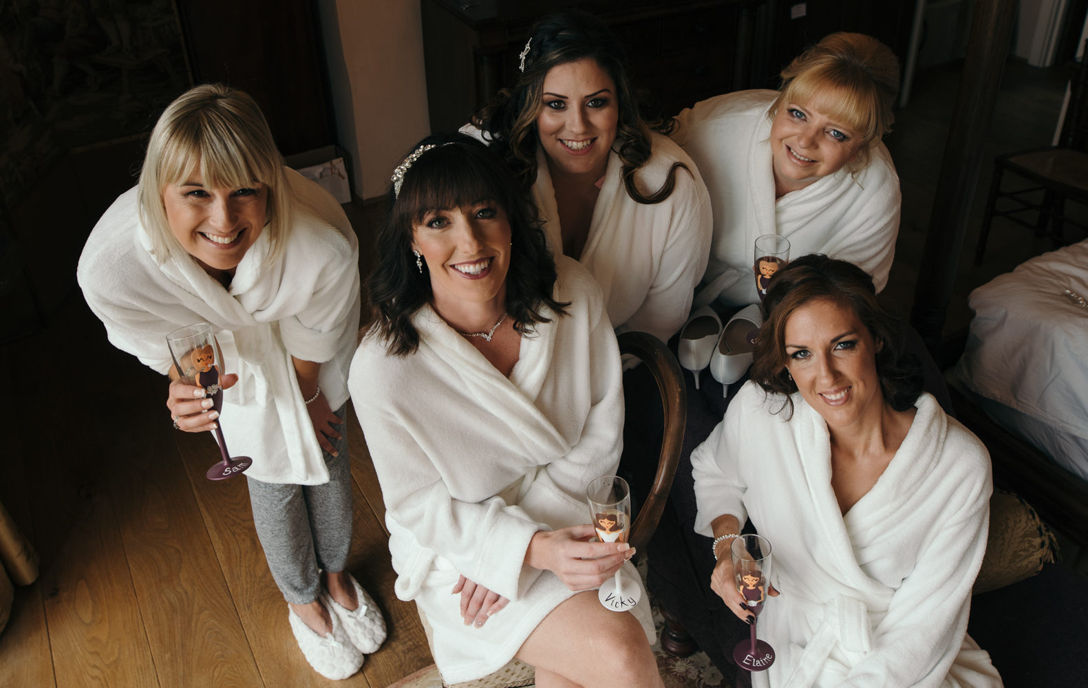 The bride and bridesmaids group shot before getting into the dresses