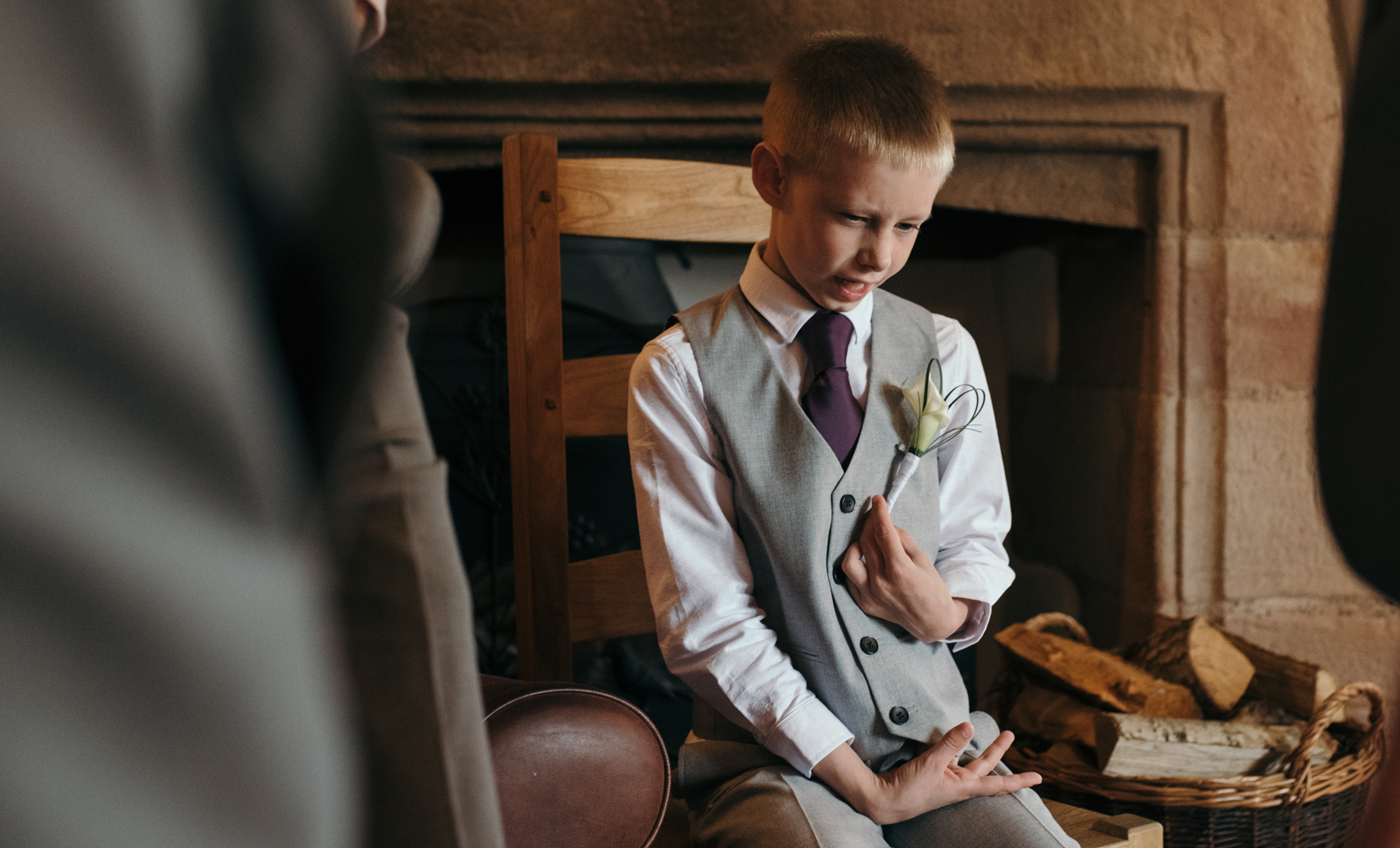 The grooms son sitting enjoying the days events