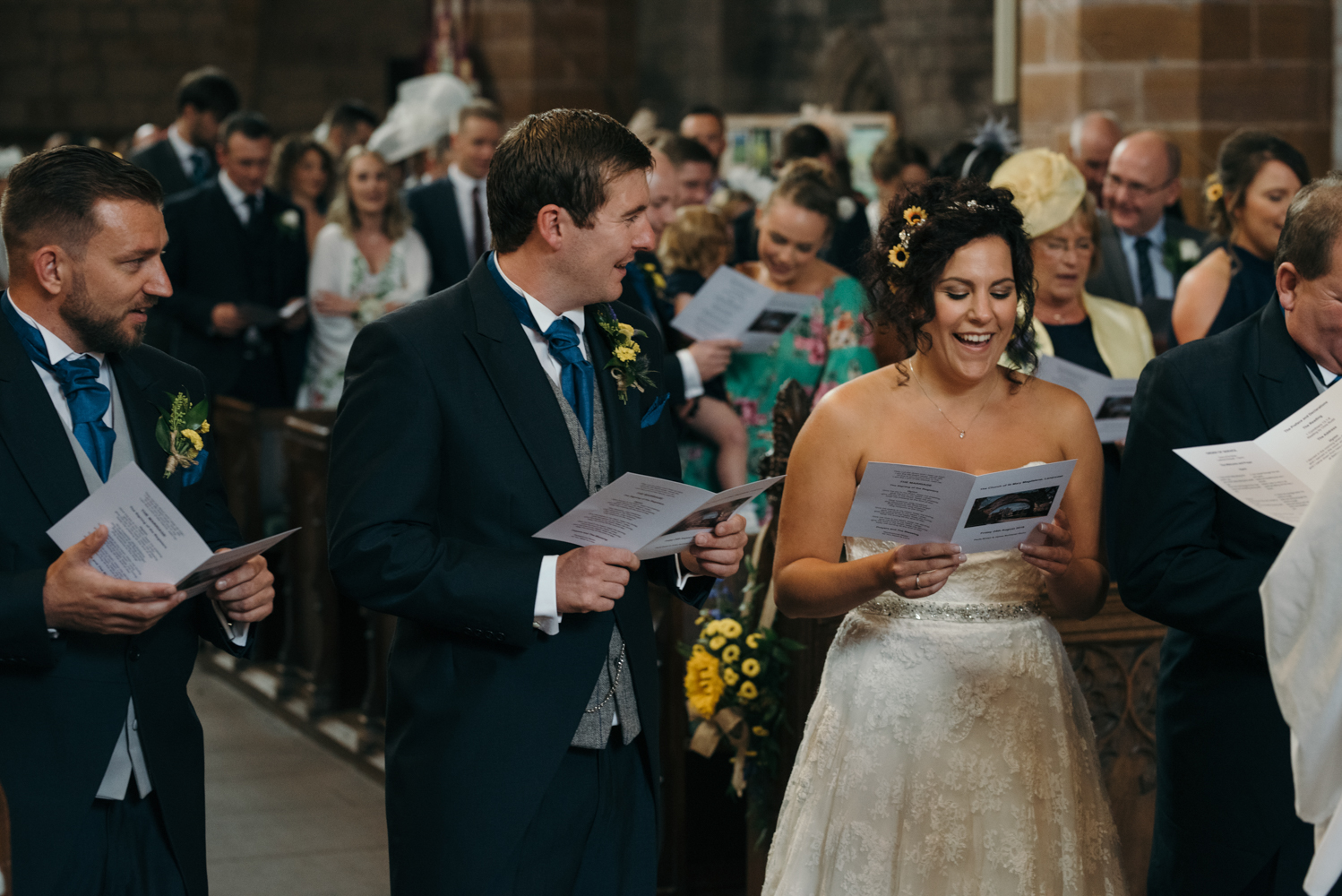 The bride and groom enjoying singing one of their chosen hymns