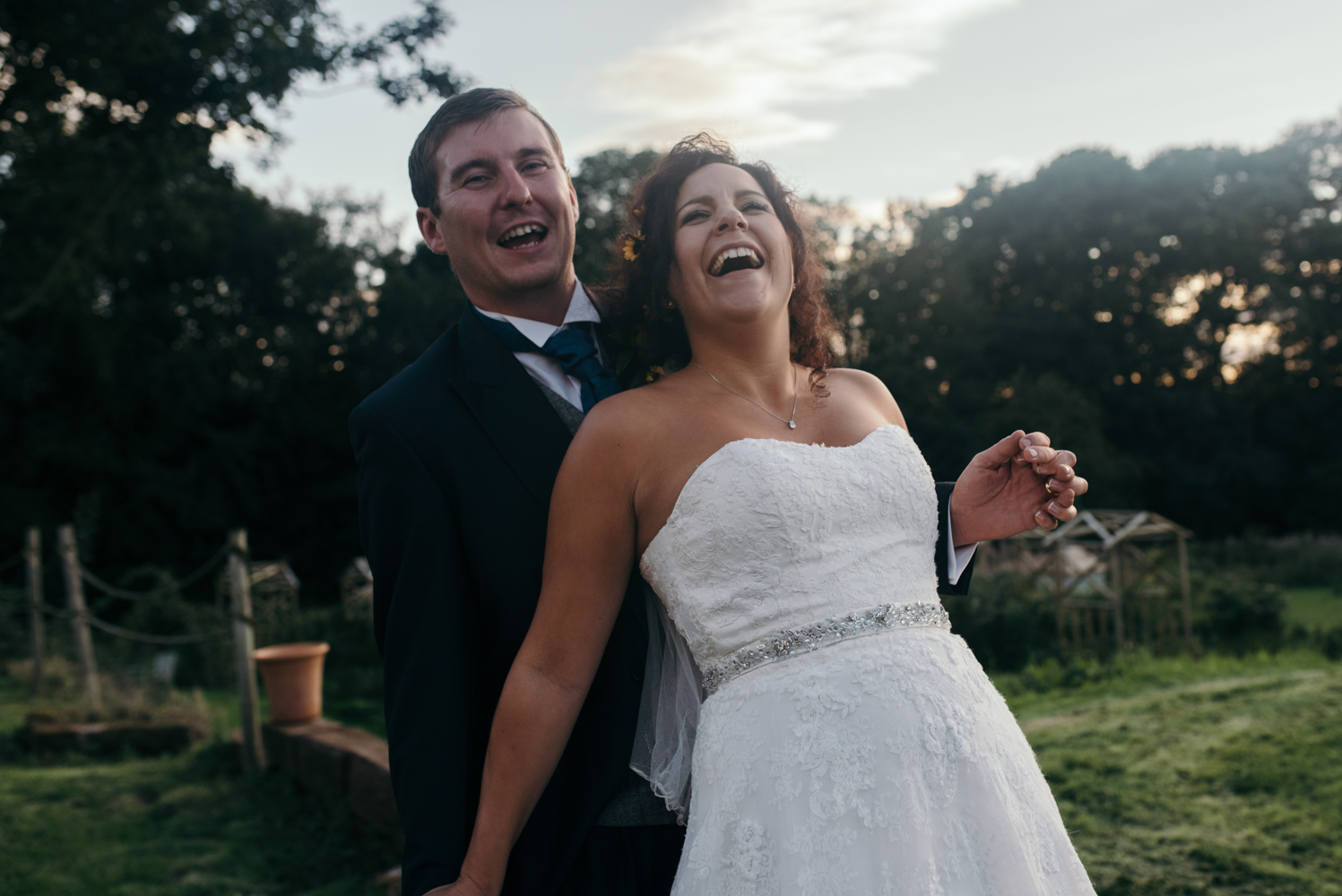 The groom tickling the bride during the portrait shoot