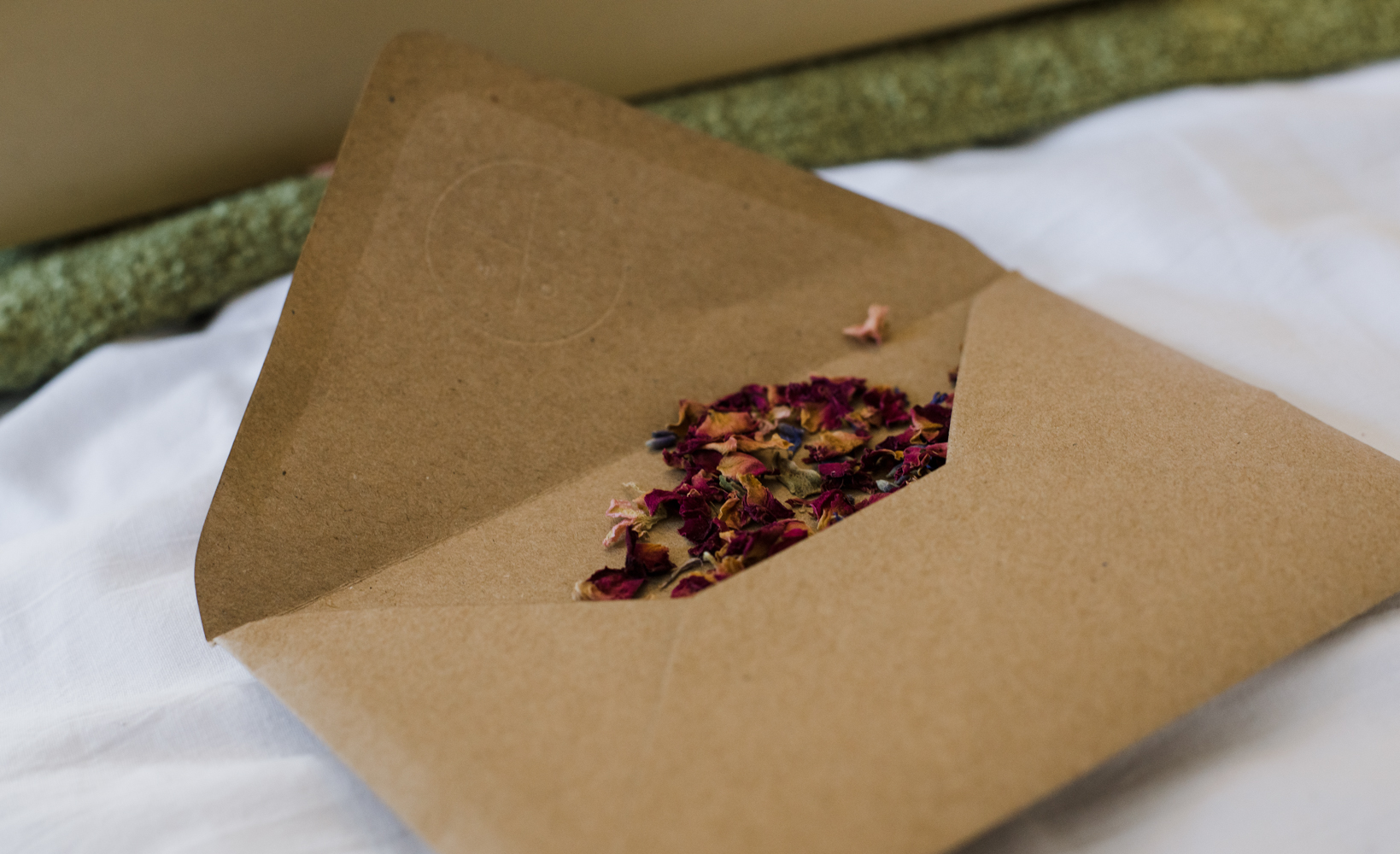 An envelope containing real flower petals to be used as confetti