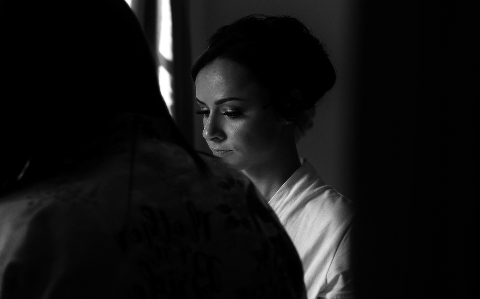 A thoughtful moment for the bride during morning preparations