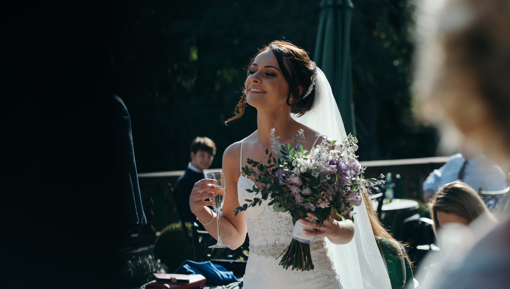 The bride enjoying a glass of bubbly during the drinks reception