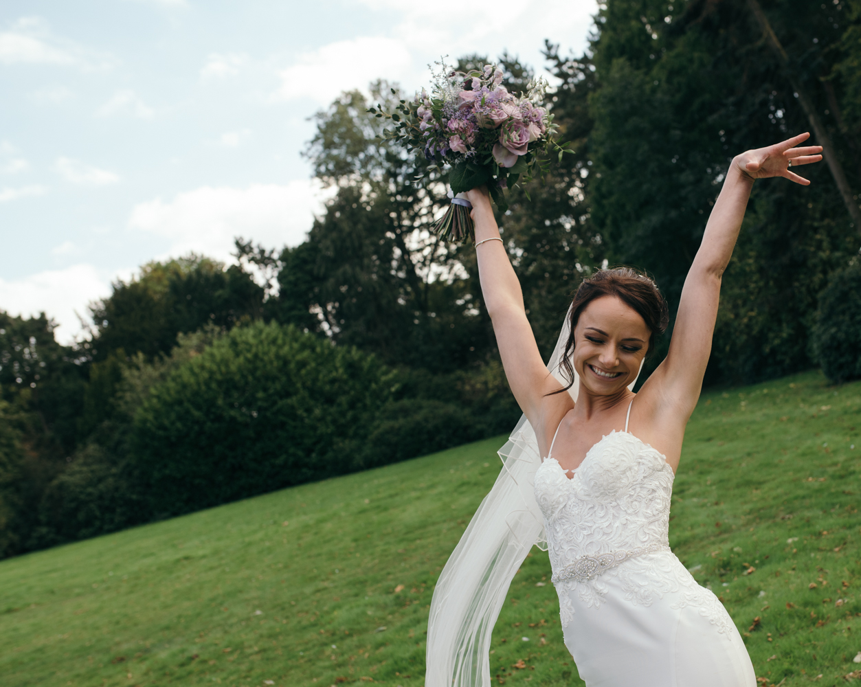 The bride strikes a pose during the family group shots
