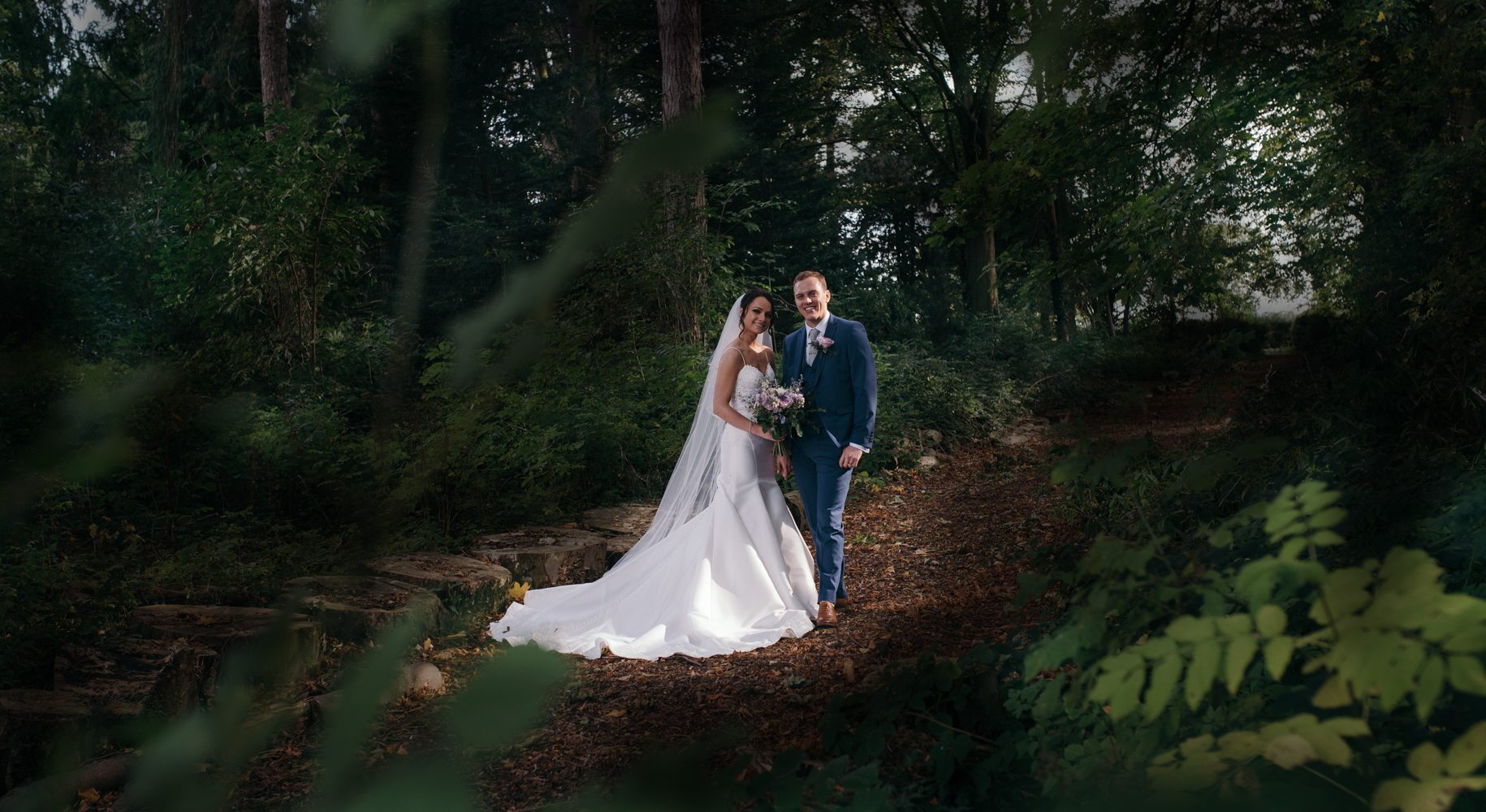 Lovely image of the bride and groom taken in the woods at Inglewood Manor