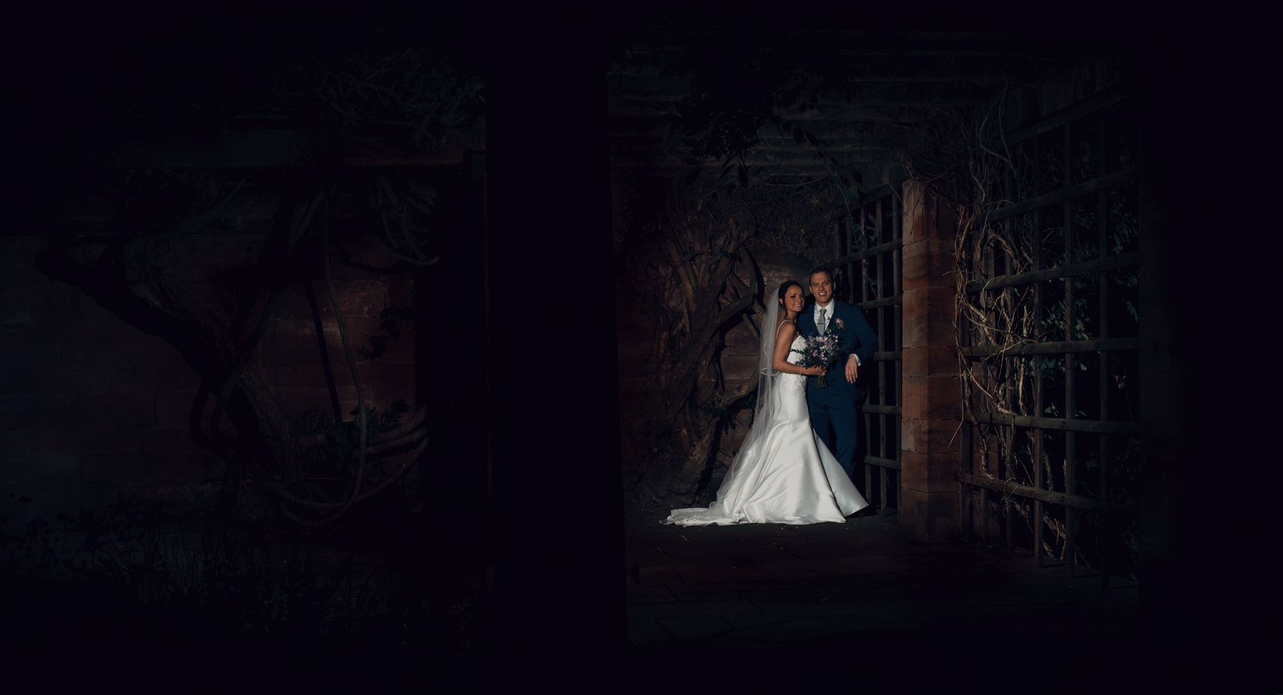 A portrait image of the bride and groom taken in the dark at Inglewood Manor