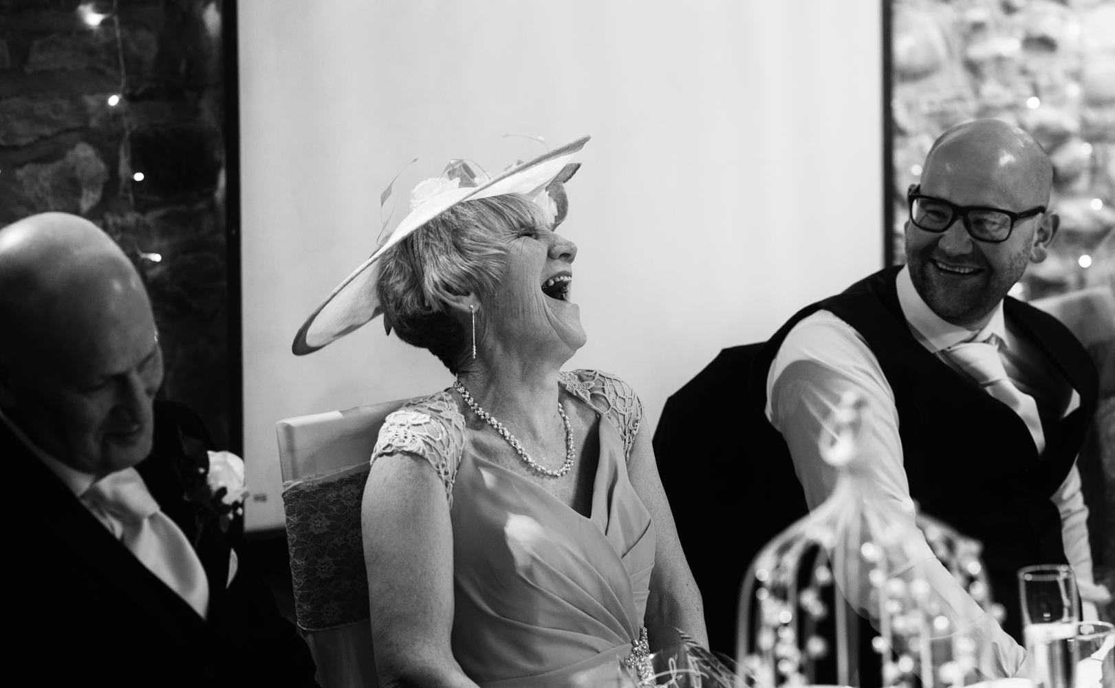 The mother of the groom laughing during the speeches