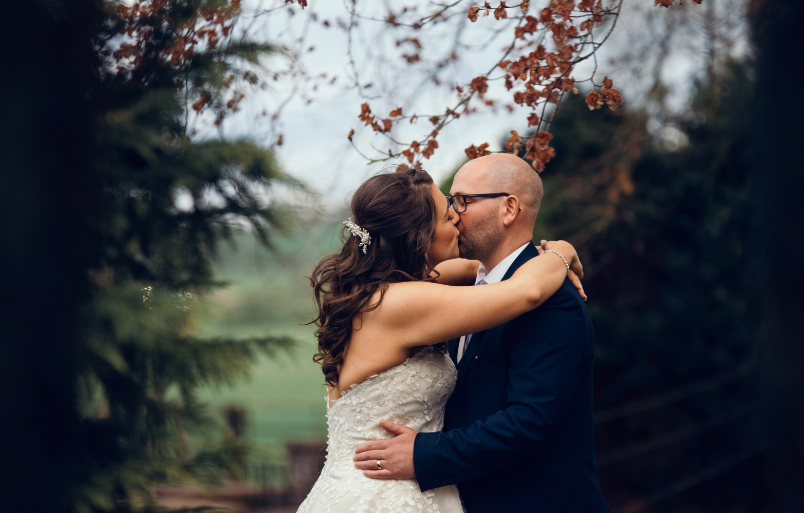 The bride and groom kissing in the gardens at Skitby wedding venue