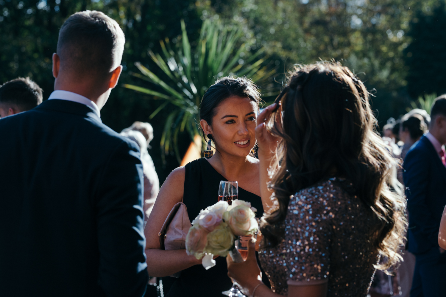 Another candid photo of one of the wedding guests during the drinks reception