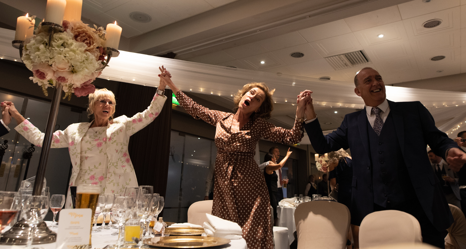 Some of the guests dancing and singing along with the singing waiters