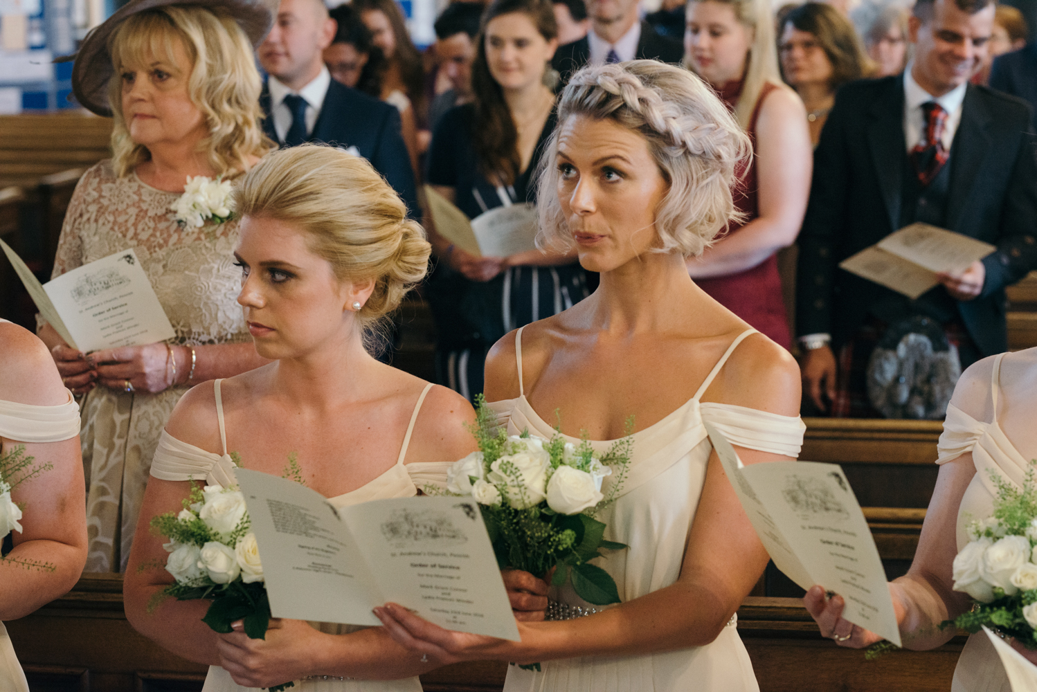 One of the bridesmaids singing in church