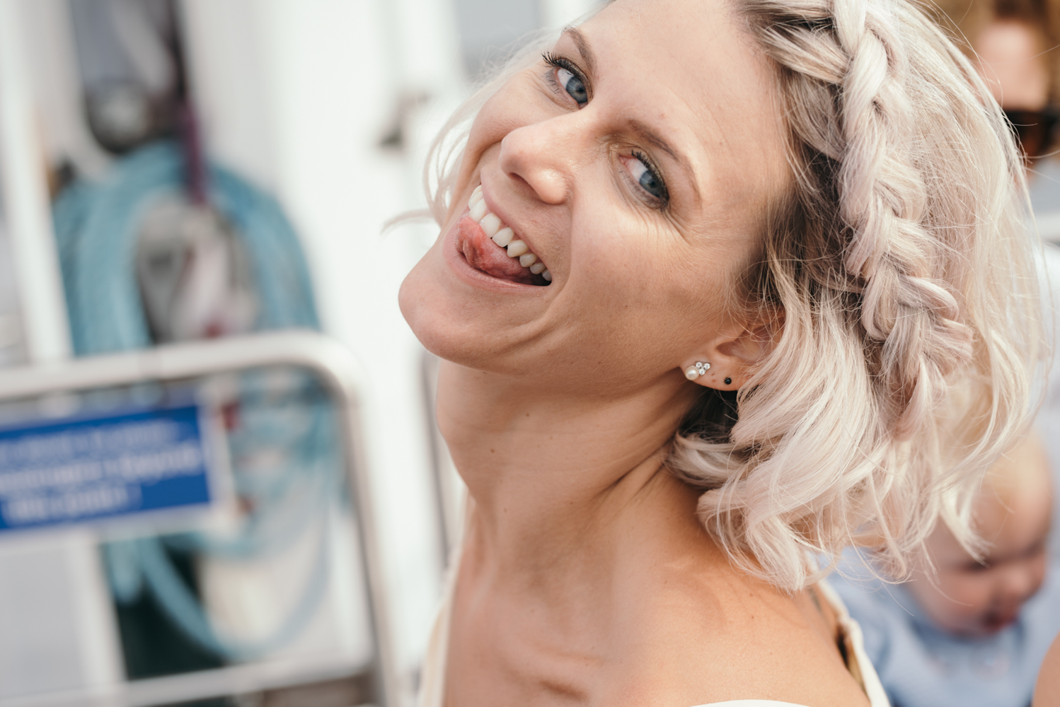A bridesmaid pulling a funny face during the lake cruise