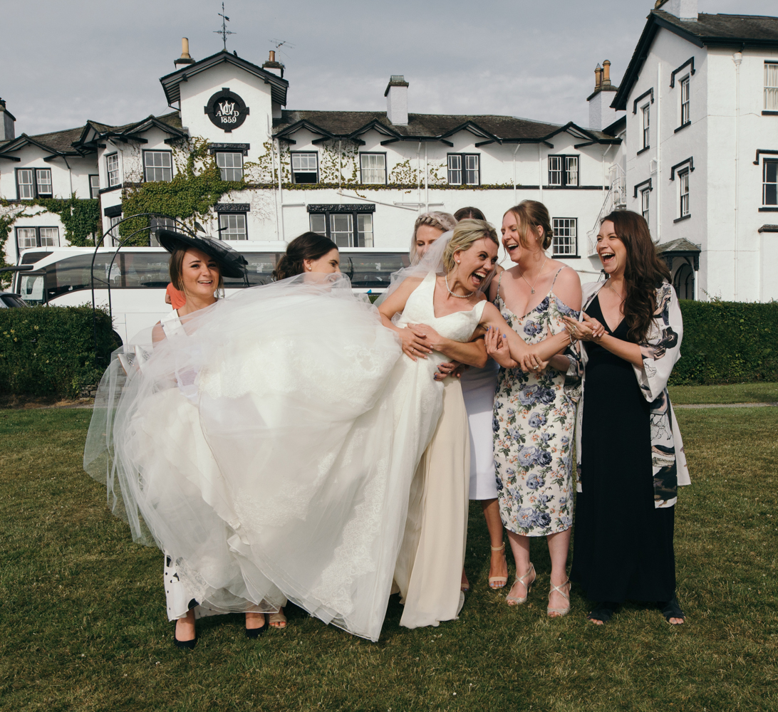 The brides friends decide it is time to pick her up for a photo