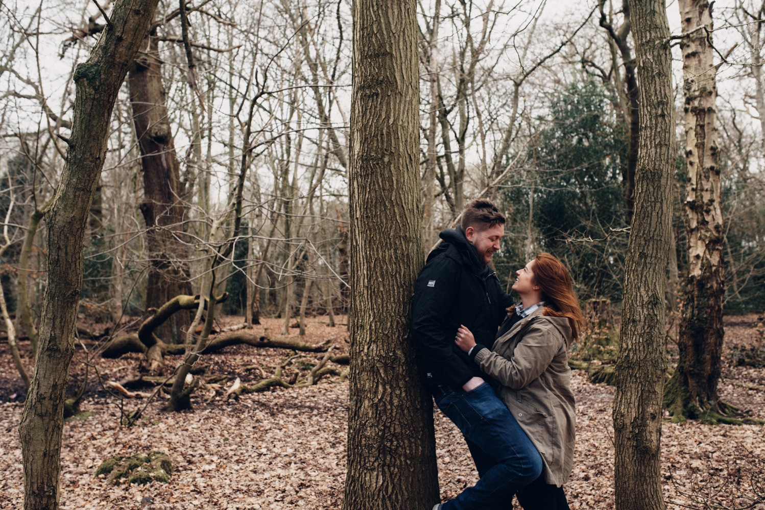Pre shoot a couple in the woods having a giggle
