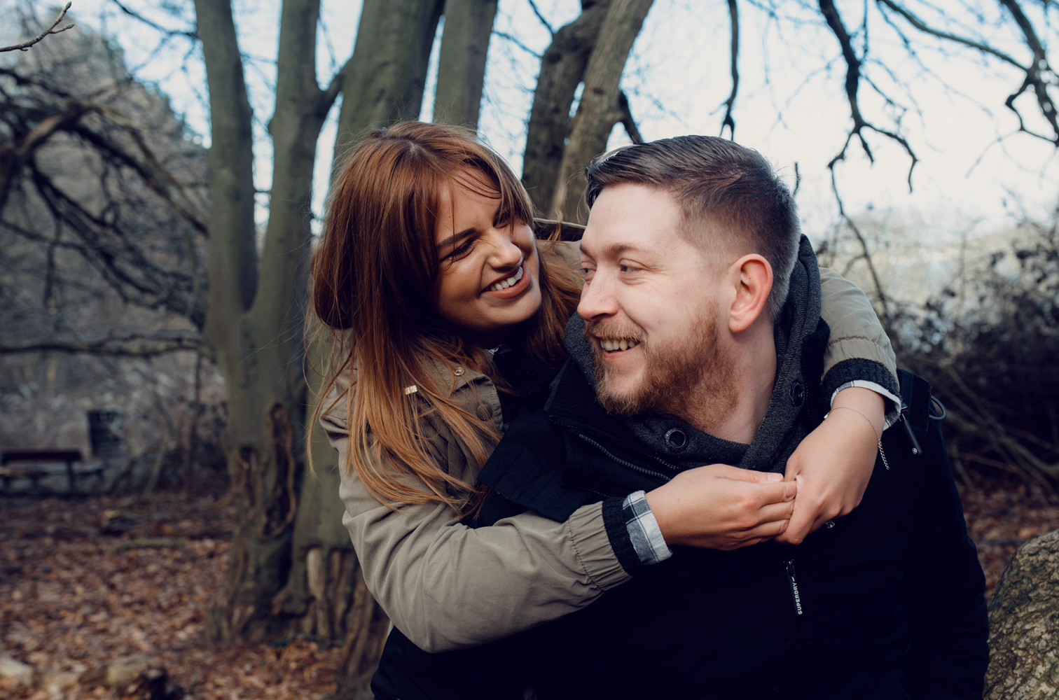 Pre shoot a couple having a hug in the woods
