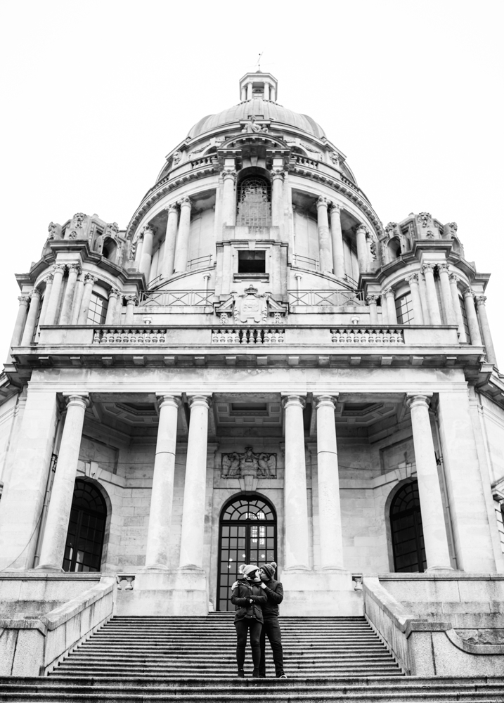 Pre shoot A black and white photo of a couple standing on the steps at Ashton Memorial Park Lancaster