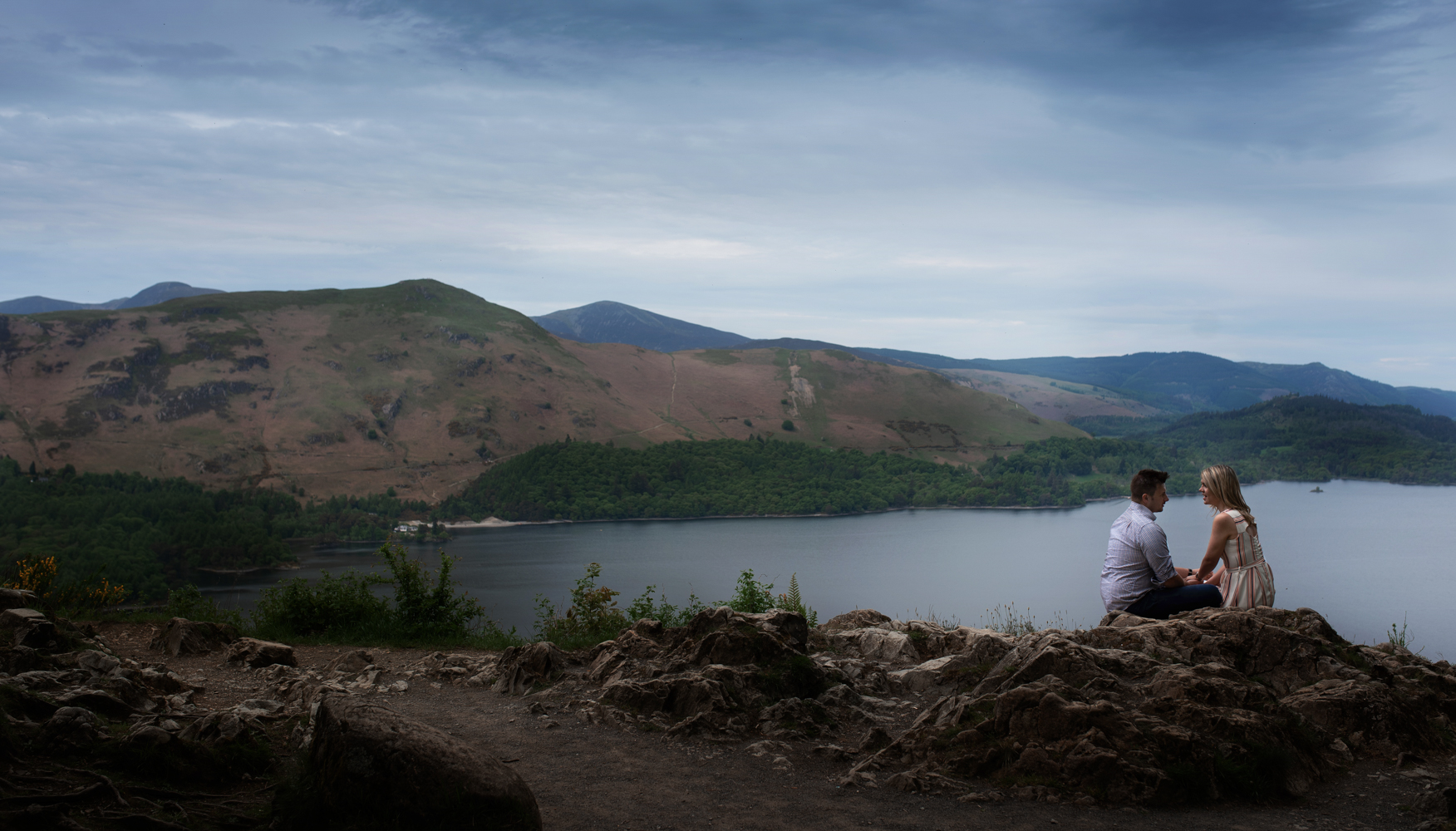 Pre shoot - A couple sitting chatting overlooking Derwent water in the Lake District