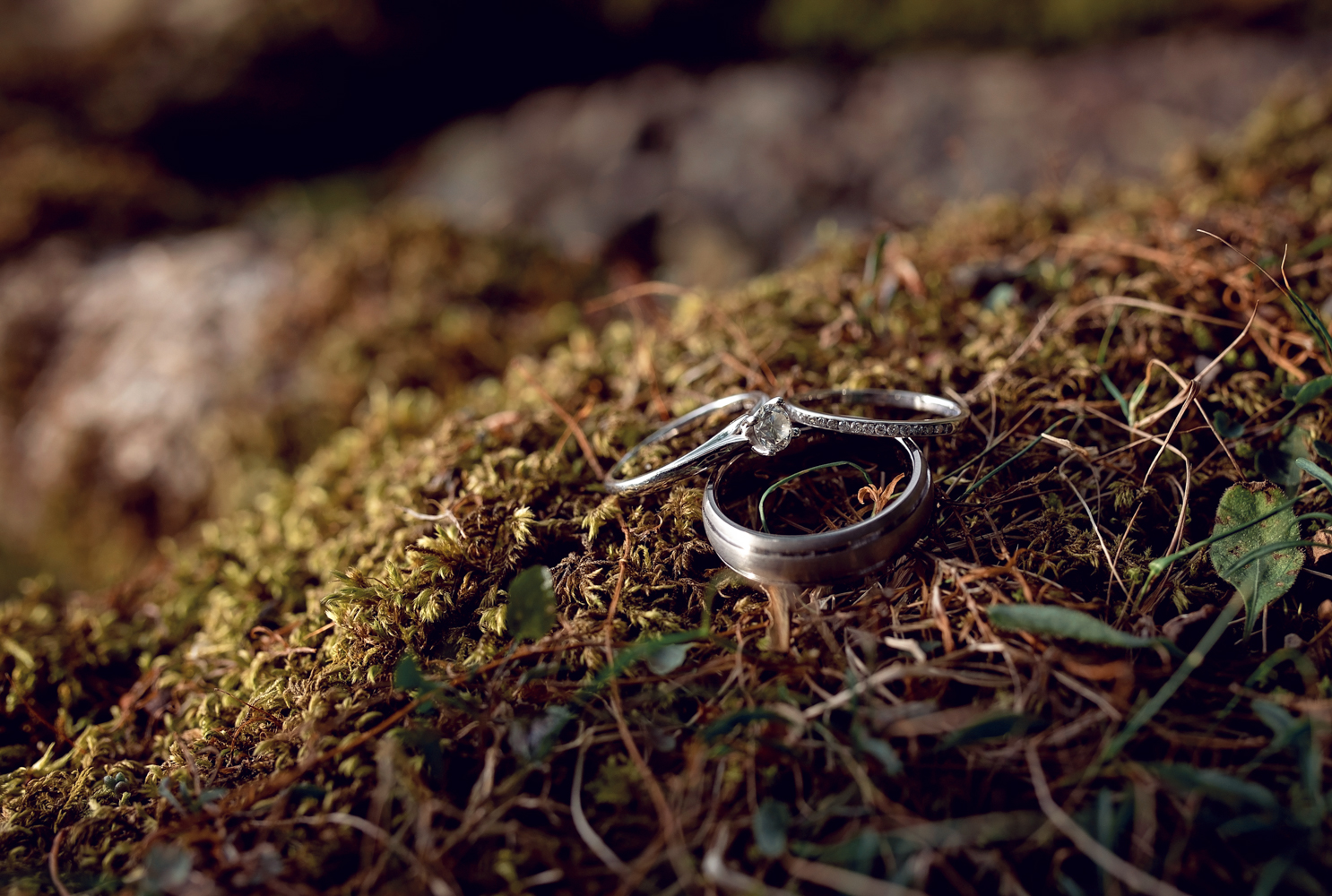 Pre shoot - The brides engagement ring on a moss covered rock at Derwent Water in The Lake District 