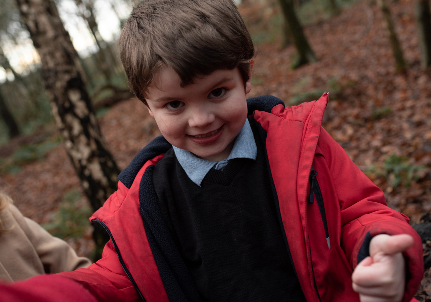 Close up photo of Sam and Russ's son in the woods