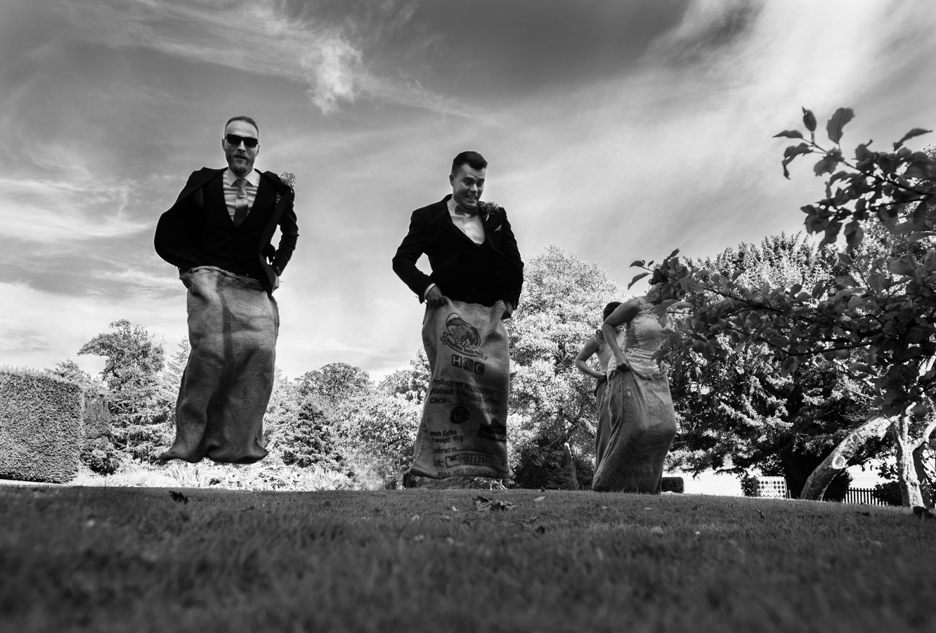 Black and white photo from the sack race at Blaithwaite House Orchard Garden