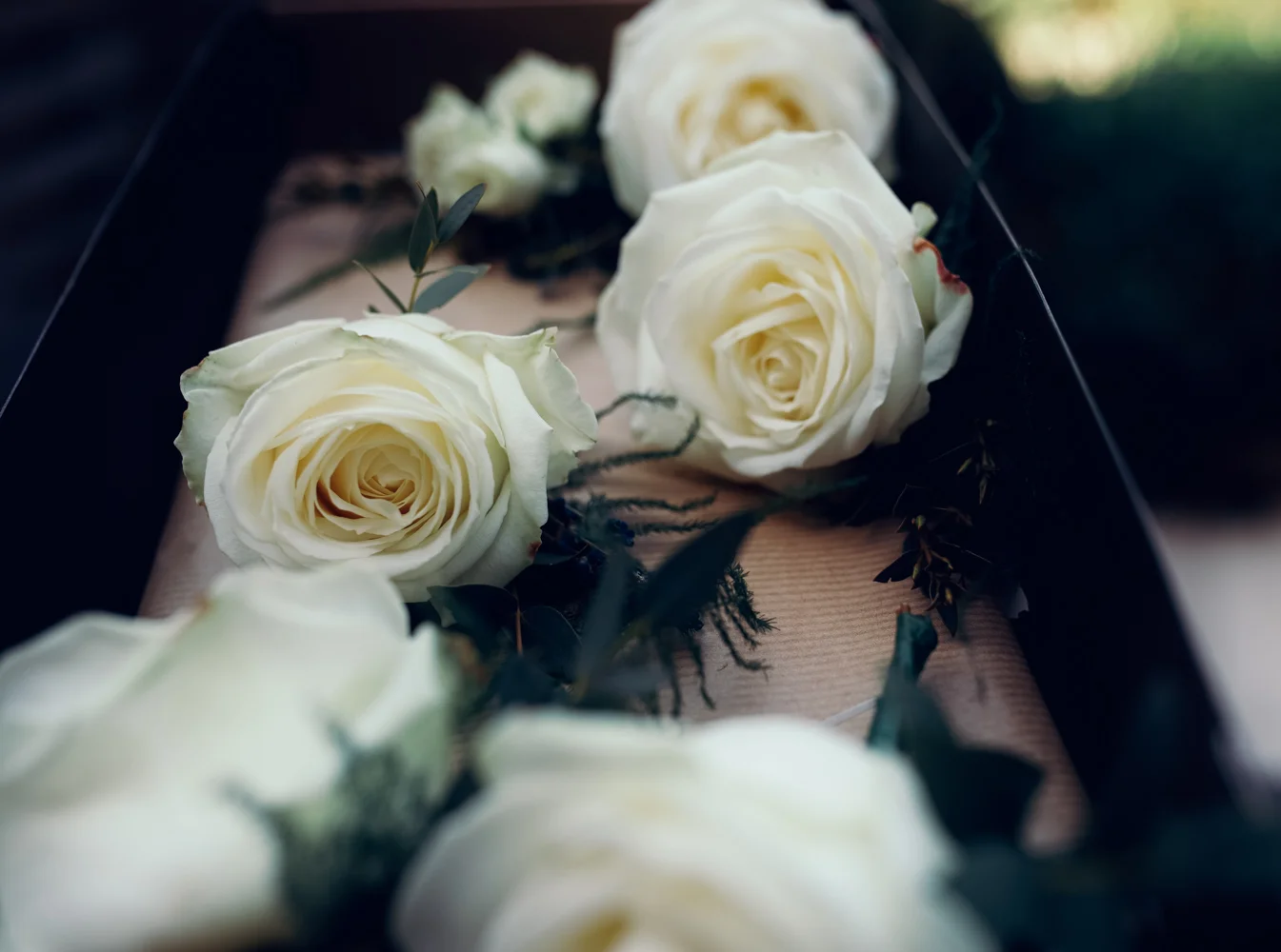 Button hole flowers in the florists box