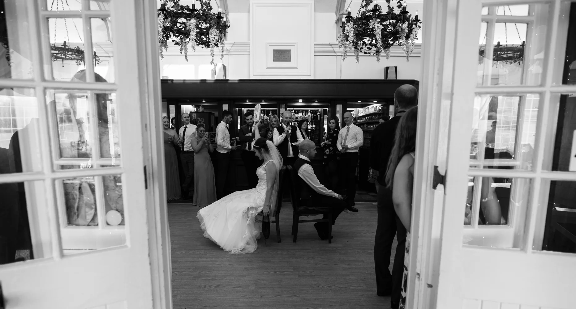 The bride and groom playing Mr and Mrs game
