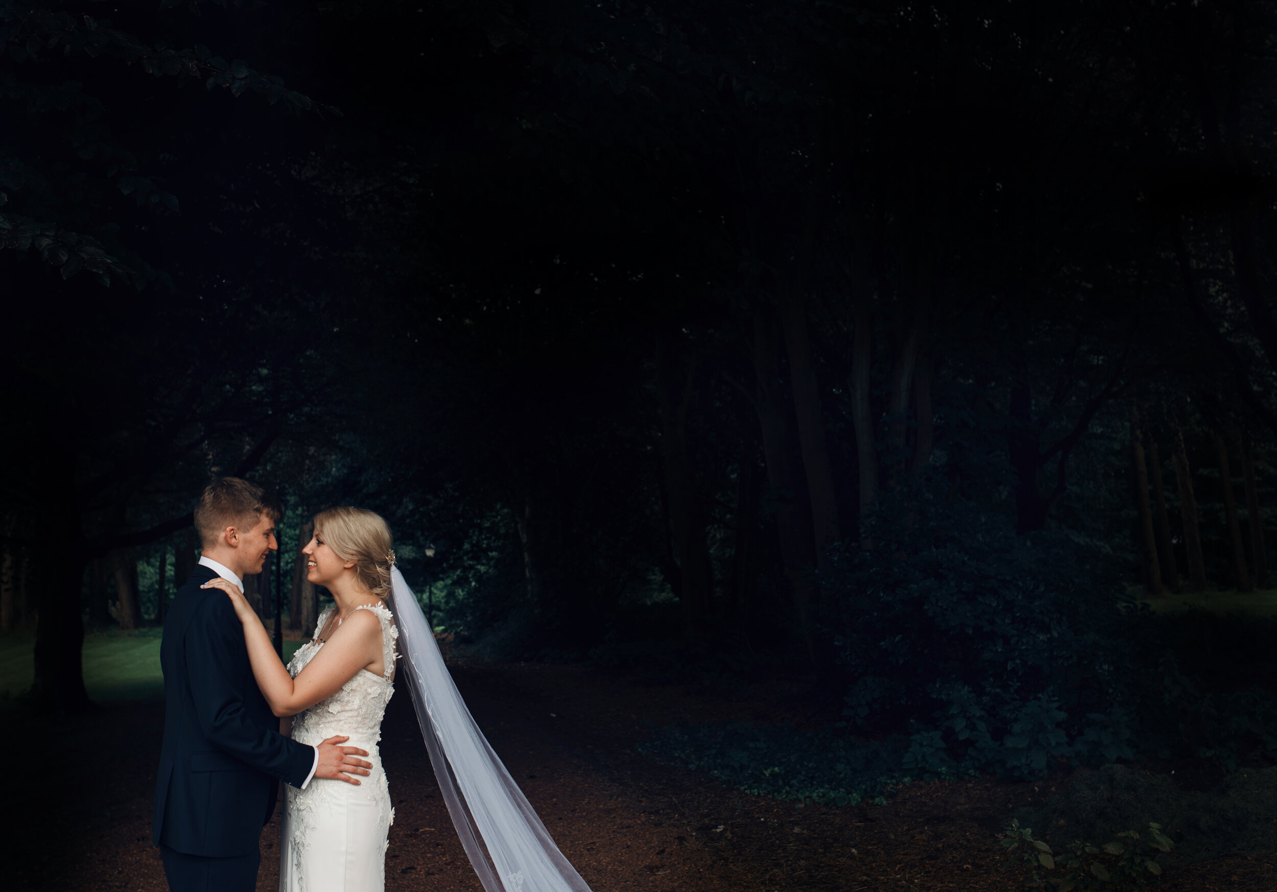 A bride and groom in the gardens at Abbey House Hotel