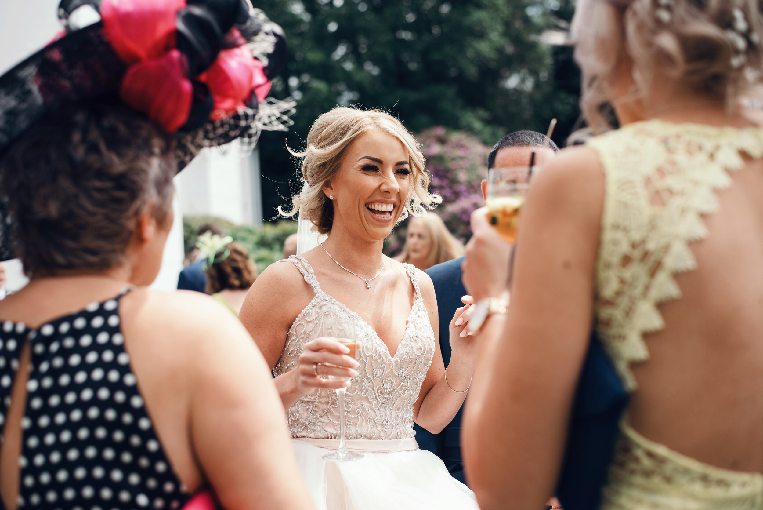 The bride enjoying a laugh and catching up with wedding guests