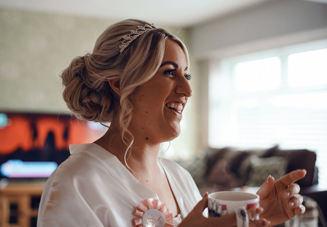 The bride having a laugh with a cuppa