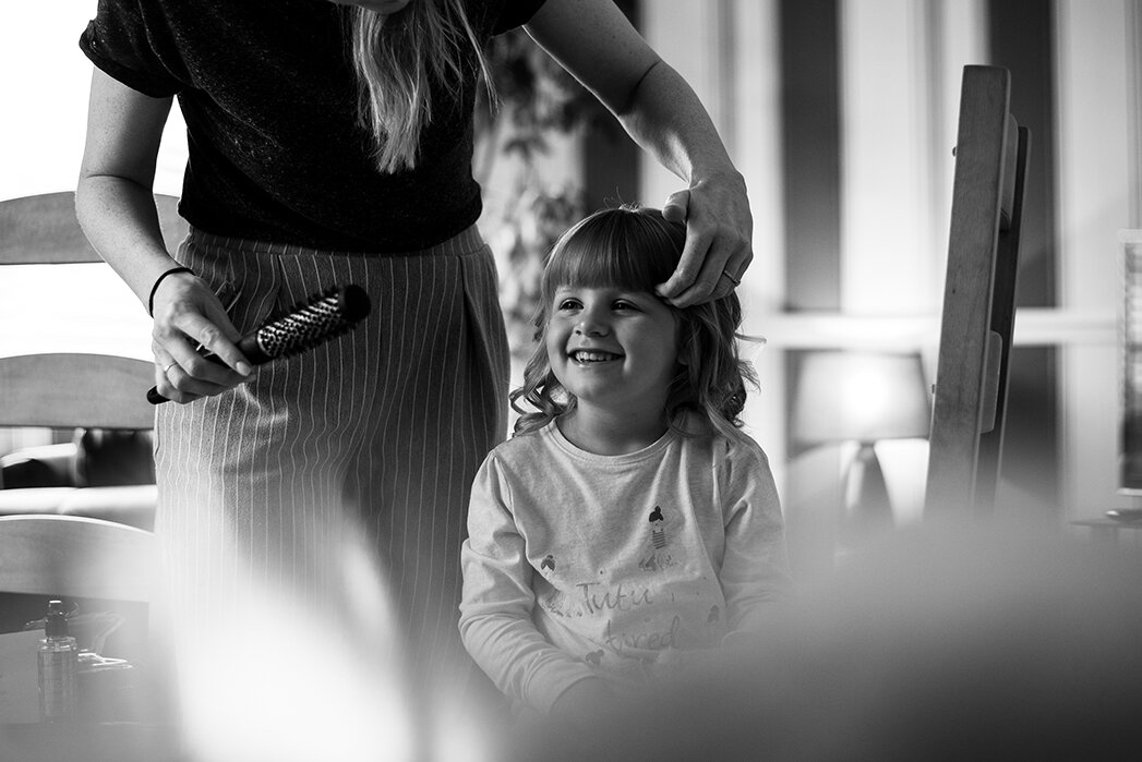 Flower girl having her hair done